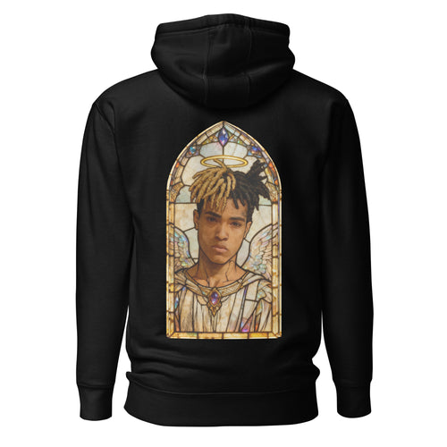 Black hoodie featuring an exclusive distressed ink portrait of xxxtentacion. The design depicts the artist as a medieval king wearing a regal crown, nose ring, and heavy gold chains over white royal robes. The artwork is encased in a vibrant gothic arched frame inspired by medieval cathedral windows and 14th-century illuminated manuscripts.